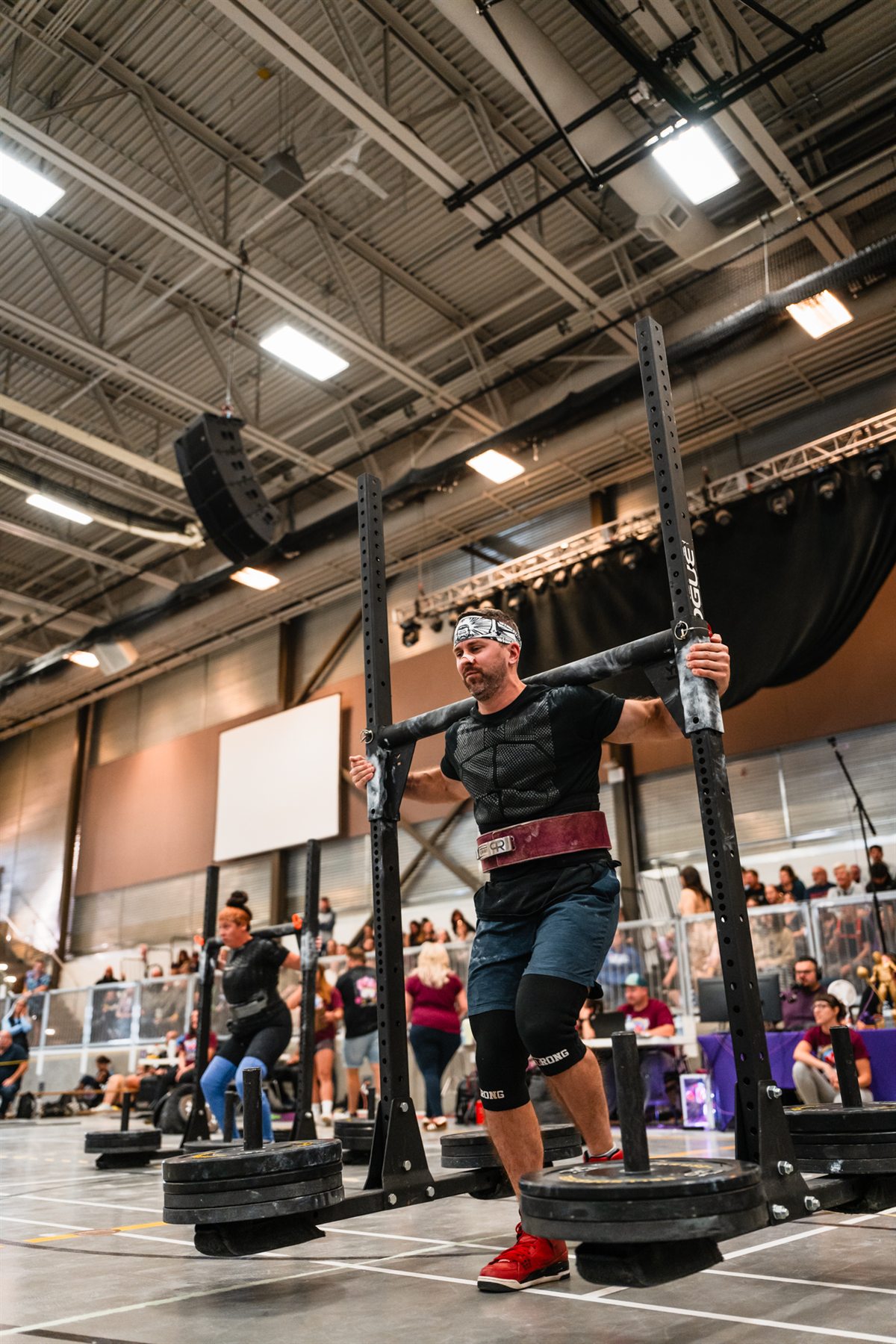 Josh Dunbar carrying a yoke during competition