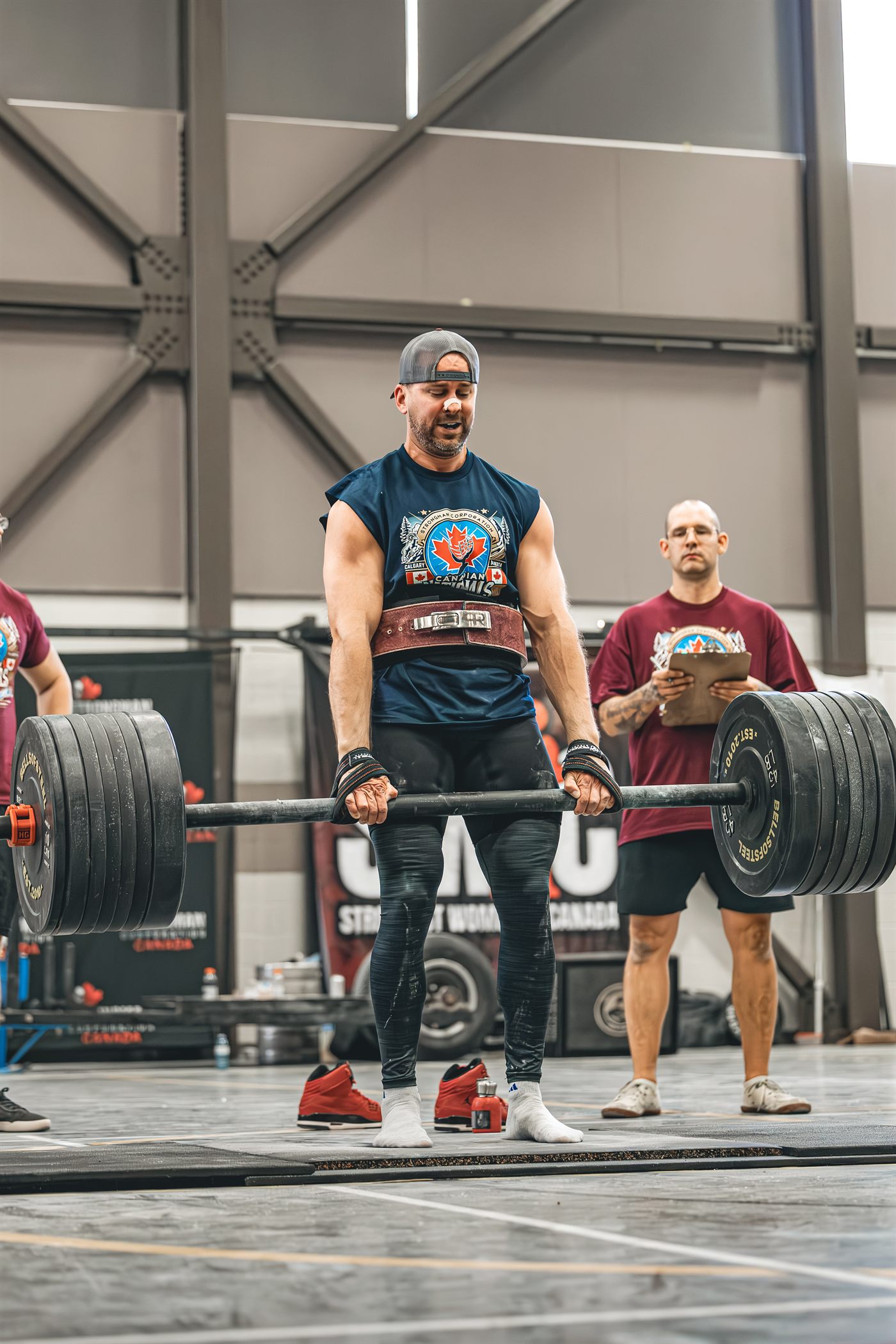 Josh Dunbar pulling a heavy deadlift during competition